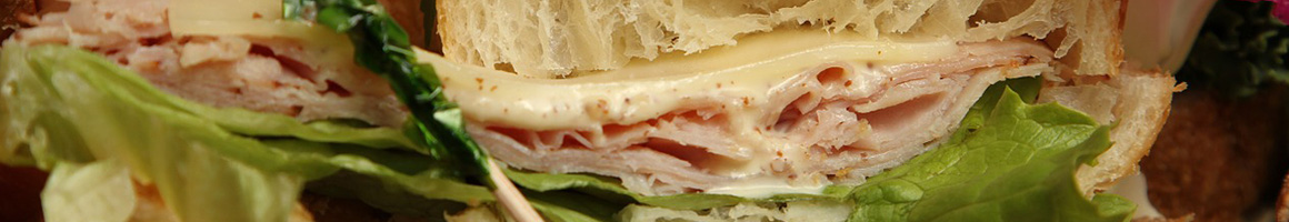 Eating Deli Sandwich at Groucho's Deli restaurant in Blythewood, SC.